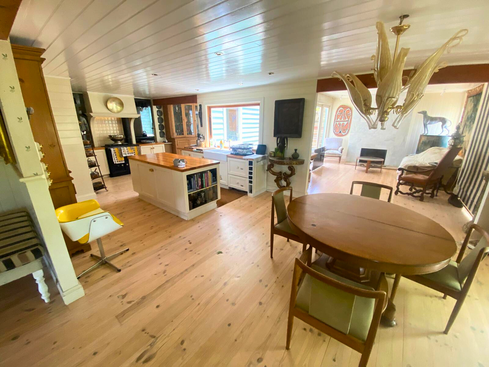 A cozy kitchen and dining room featuring a table and chairs, designed for communal dining at the Follow Through House facility. A cozy kitchen and dining room featuring a table and chairs, designed for communal dining at the Follow Through House (Women’s addiction recovery retreat) facility.