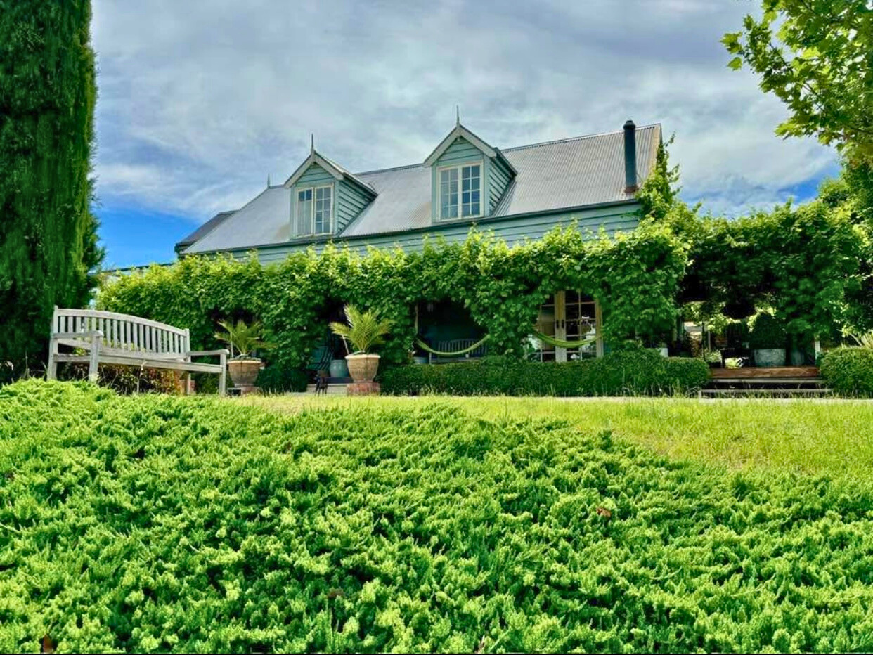 The Follow Through House facility features a lovely house with a garden and a welcoming bench in front. The Follow Through House facility (Women’s addiction recovery retreat) features a lovely house with a garden and a welcoming bench in front.